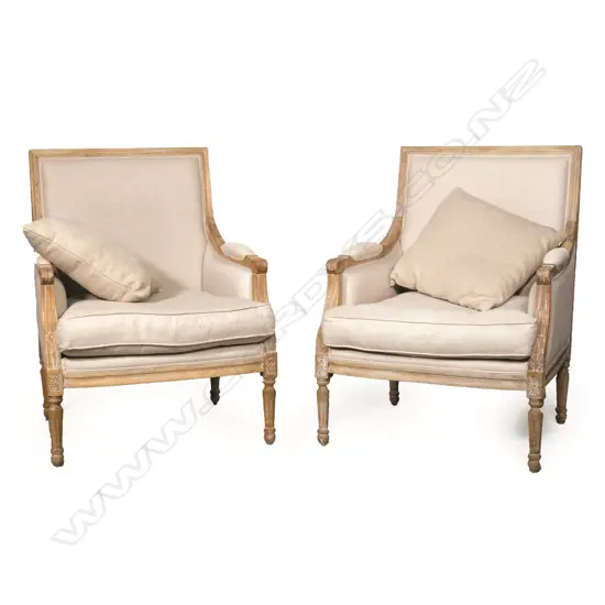 A pair of lightly whitewashed oak framed bergeres