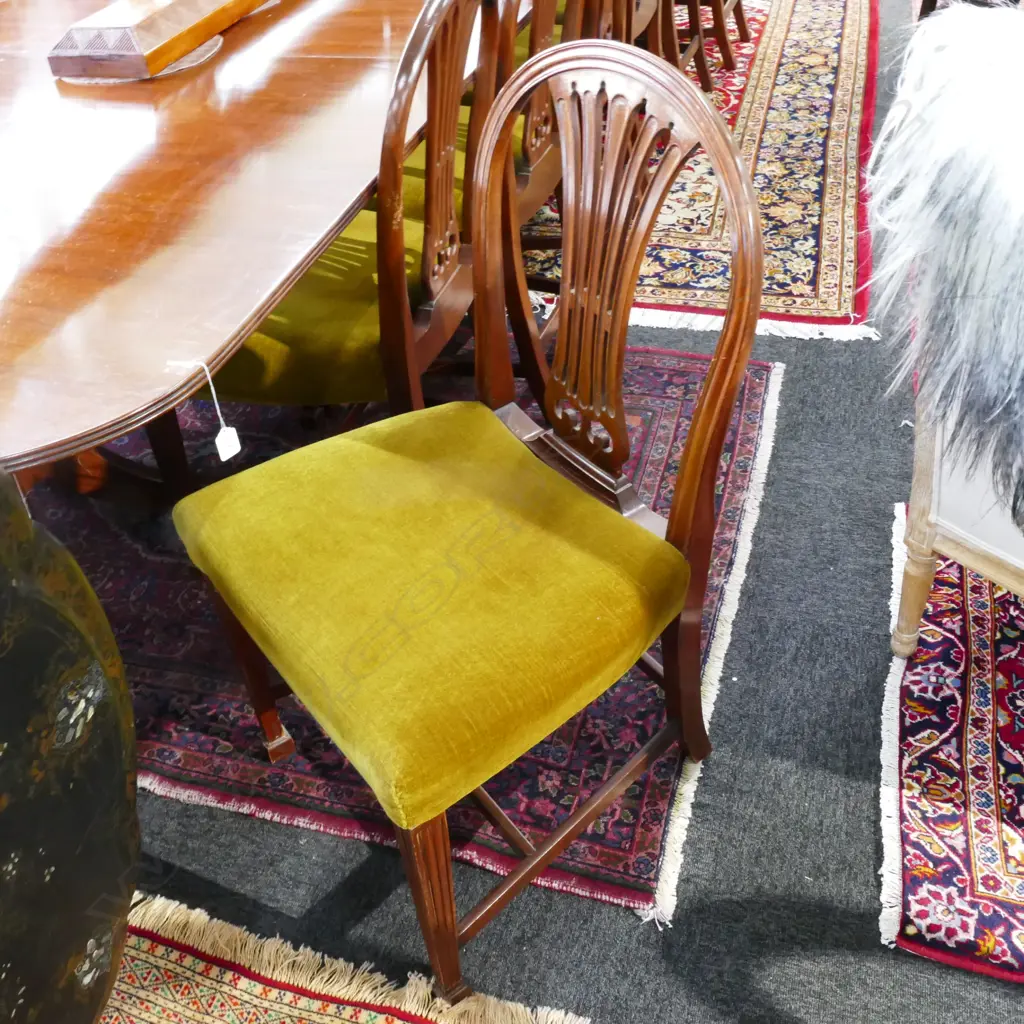 A mahogany banqueting extension Regency style dining table and sixteen Hepplewhite style chairs Image 1++