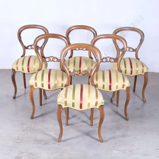A set of six Victorian mahogany balloon back dining chairs
