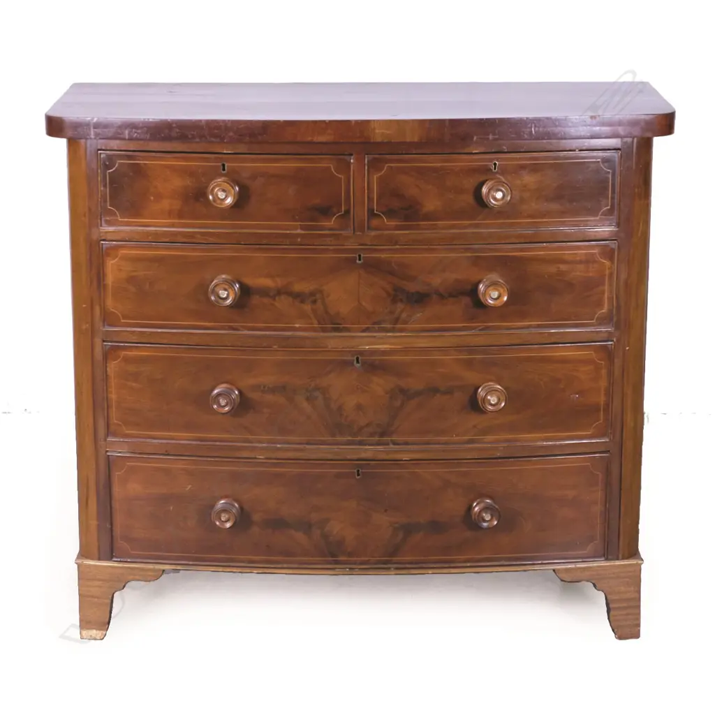 A Georgian mahogany bow front five drawer chest Image 1++