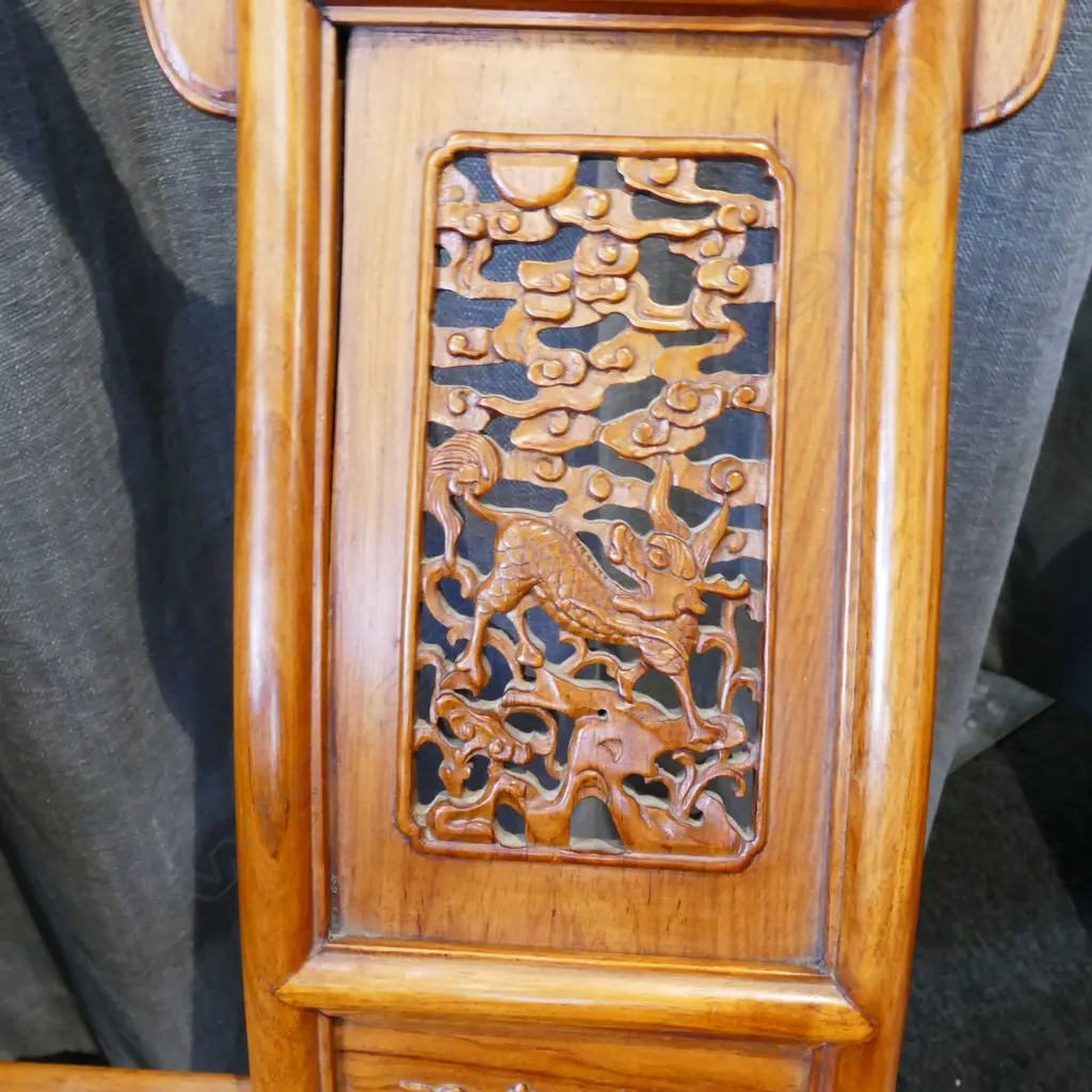 A pair of Chinese hardwood horseshoe-back folding armchairs Image 1++