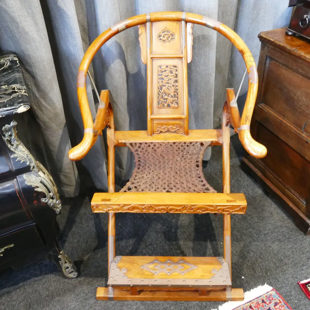 A pair of Chinese hardwood horseshoe-back folding armchairs Image 1++