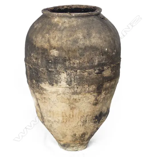 An old European terracotta tall storage jar