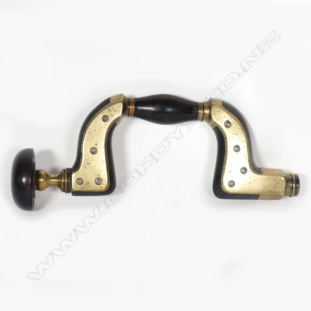 An ebony brass plated brace Image 1++