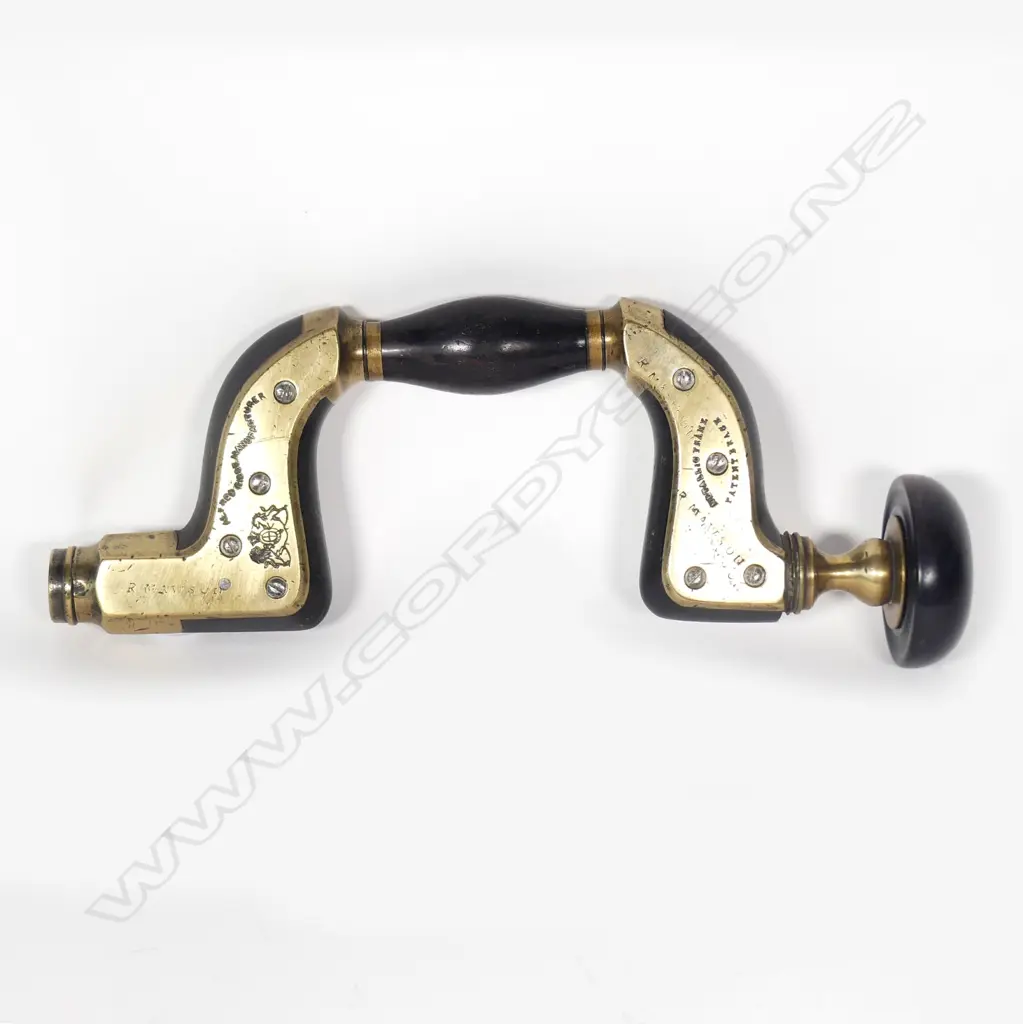 An ebony brass plated brace Image 1++