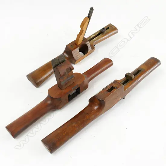 Three wooden two-handled routers