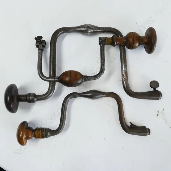Three large vintage metal armed braces