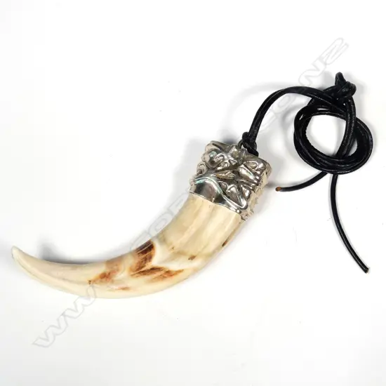 A warthog tusk pendant