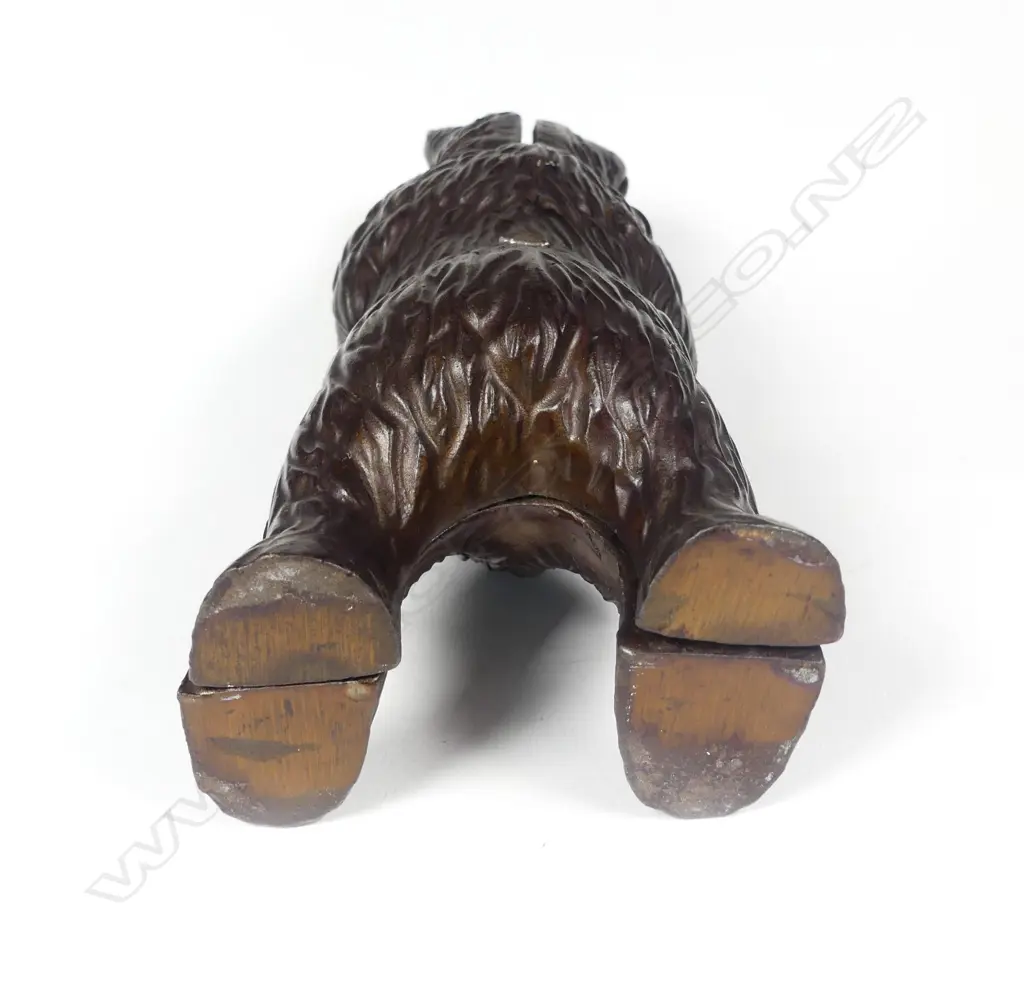 A cast iron standing bear money box Image 1++