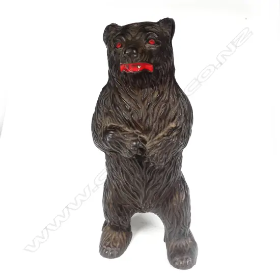 A cast iron standing bear money box