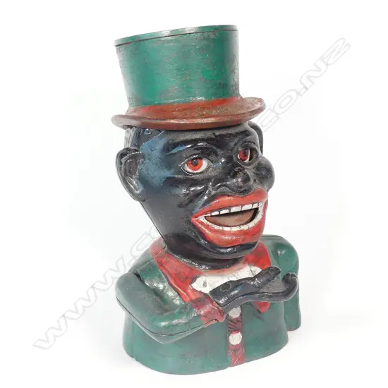A cast iron 'Jolly Boy' money box