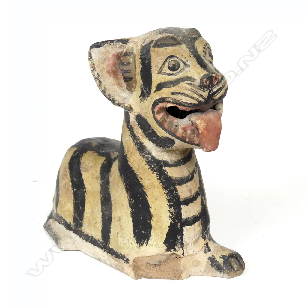 An antique pottery recumbent tiger money box Image 1++