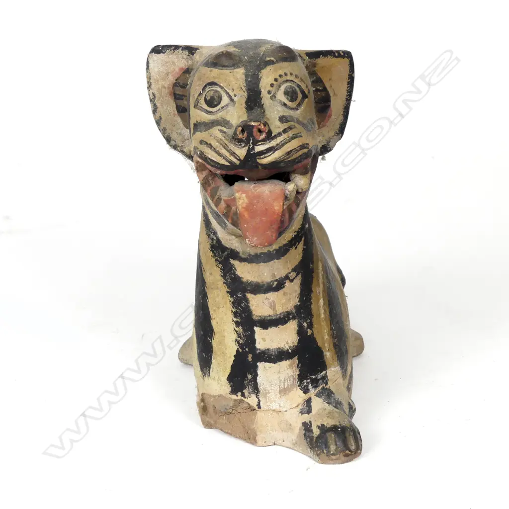 An antique pottery recumbent tiger money box Image 1++