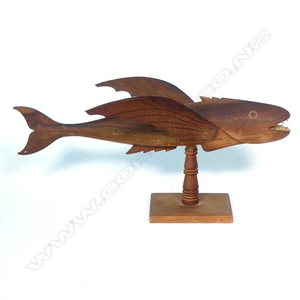 A Pitcairn Island souvenir carved flying fish on stand Image 1++