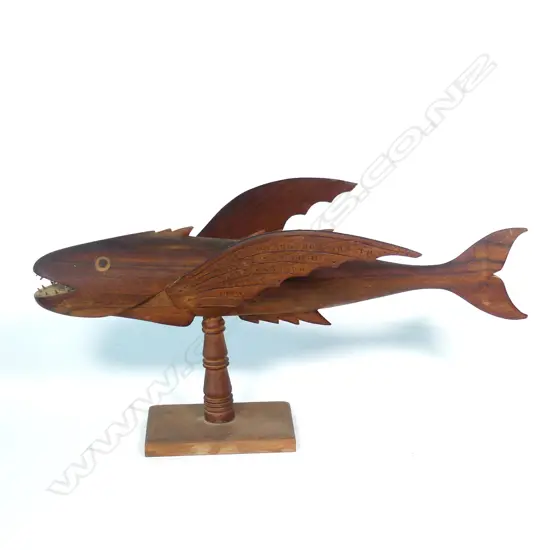 A Pitcairn Island souvenir carved flying fish on stand