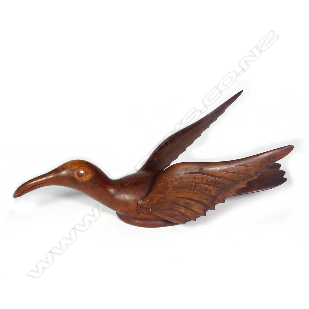 An uncommon Pitcairn Island carved bird on the water Image 1++