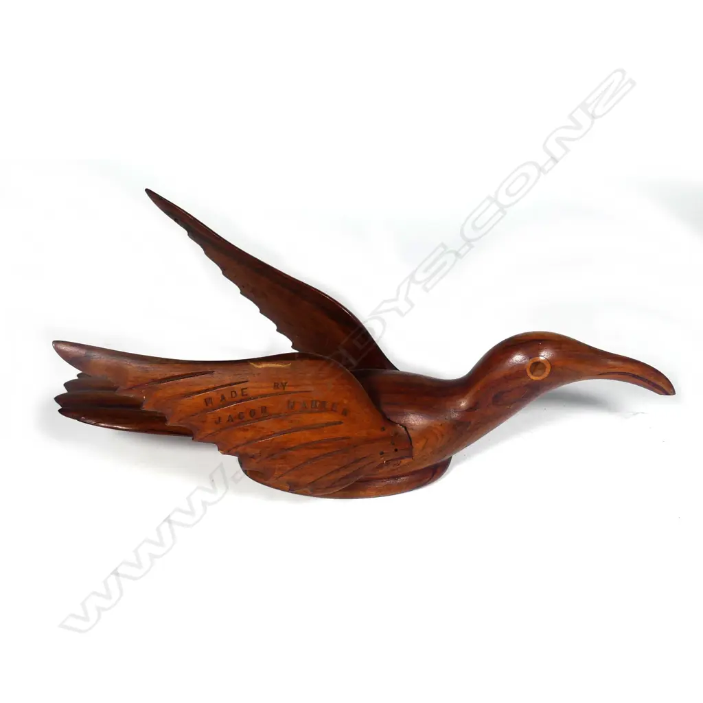 An uncommon Pitcairn Island carved bird on the water Image 1++