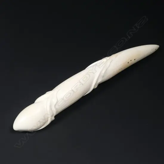 Des Baker carved ivory tusk as a revealing form