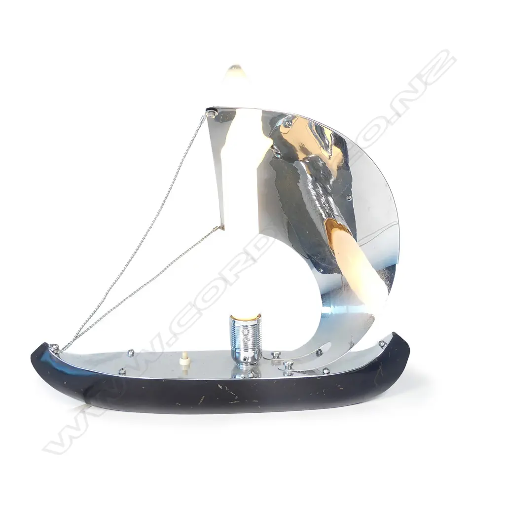 An Art Deco chrome and ebonised metal stylised Viking sailboat lamp Image 1++