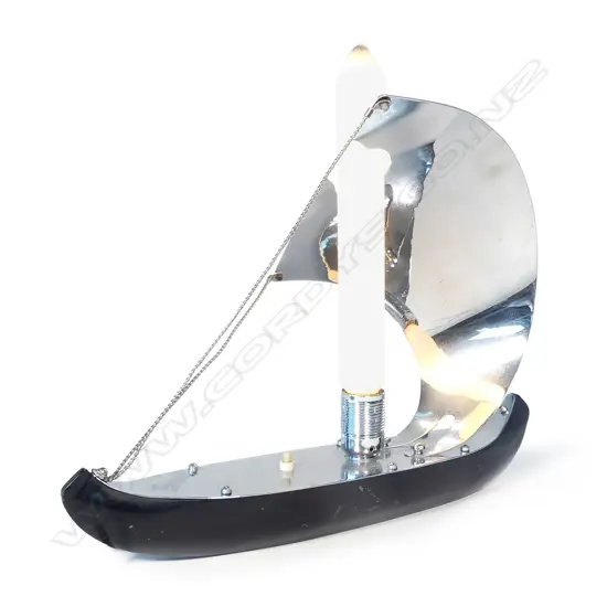 An Art Deco chrome and ebonised metal stylised Viking sailboat lamp