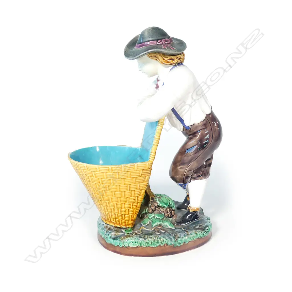 A Victorian Minton majolica young grape picker with basket Image 1++