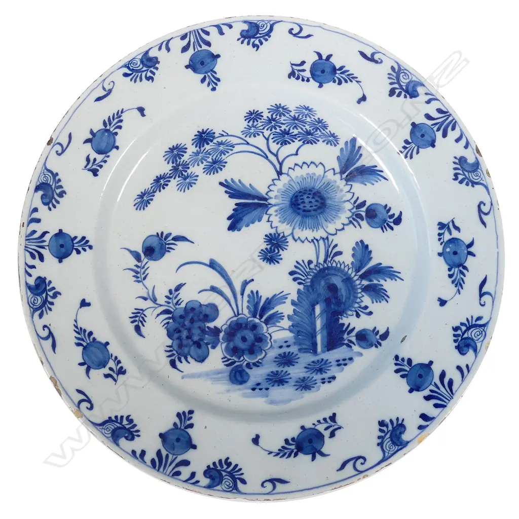 A large Delft blue and white tin glazed charger Image 1++