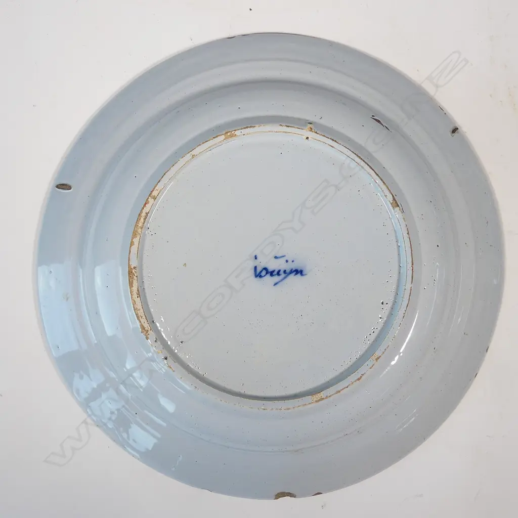 A large Delft blue and white tin glazed charger Image 1++
