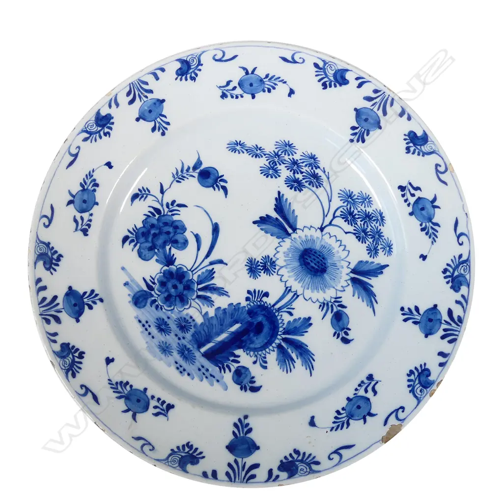 A large Delft blue and white tin glazed charger Image 1++
