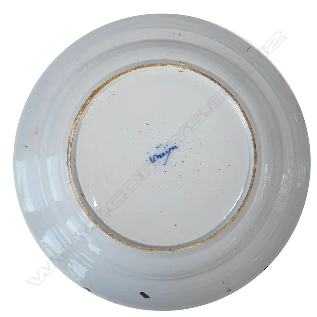 A large Delft blue and white tin glazed charger Image 1++