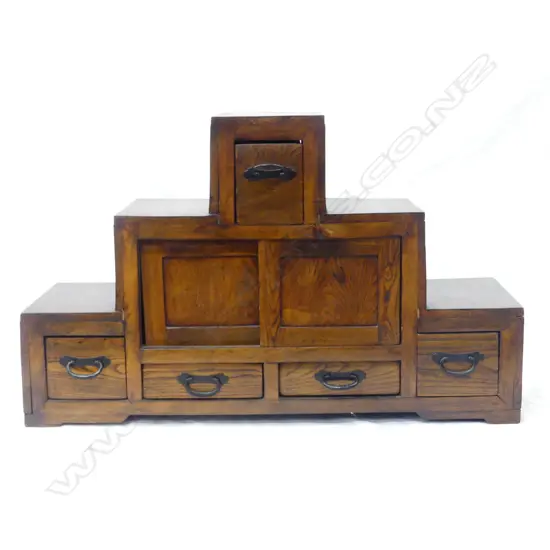 An uncommon Japanese Meiji period elm small step chest/display stand
