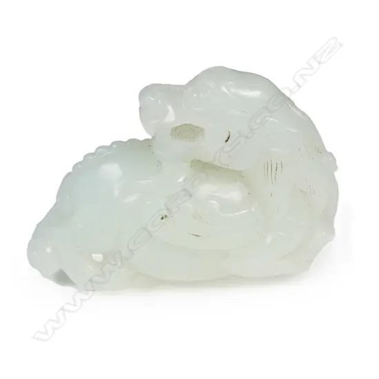A Chinese white jade dragon handling piece/pendant