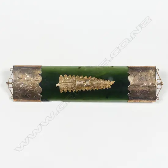A large N.Z. colonial greenstone and 9ct. gold mounted bar brooch