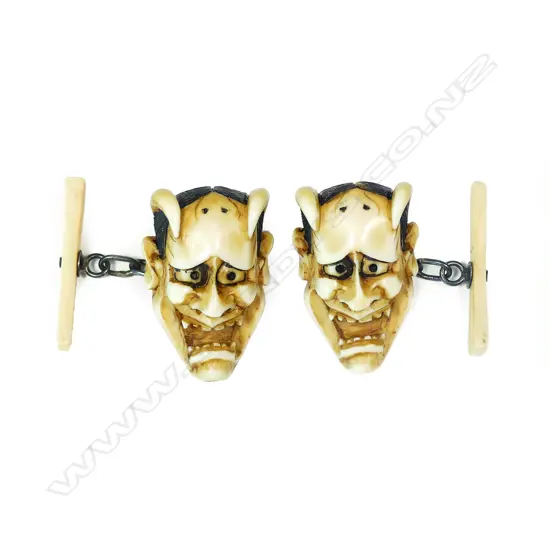 A pair of Japanese Meiji carved ivory Hannya noh mask cufflinks
