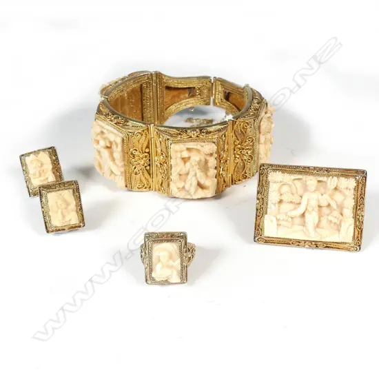 A vintage gilded silver and carved ivory jewellery suite