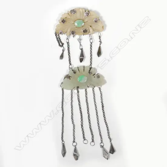 A vintage carved jade and silver two piece suspending brooch