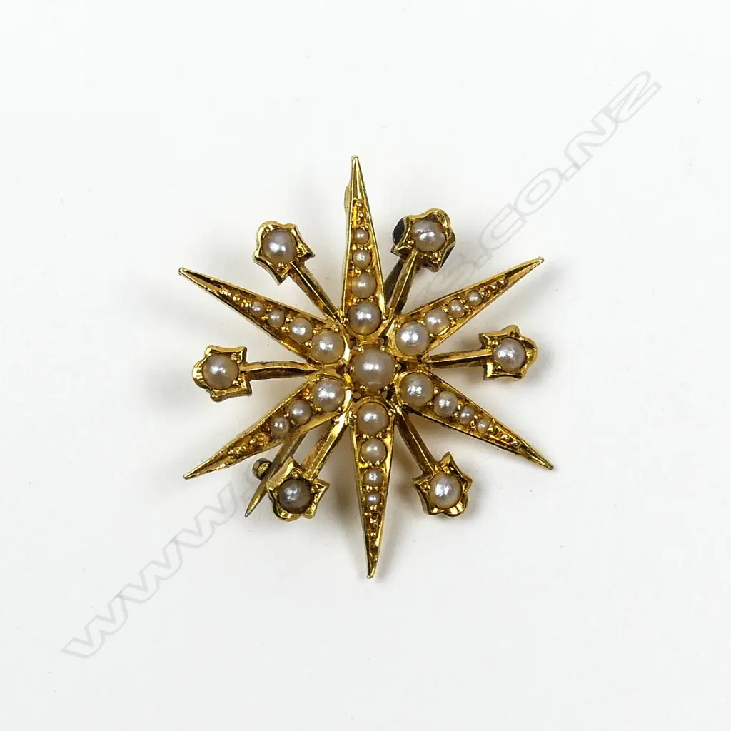 A Victorian 15ct gold and seed pearl starburst brooch Image 1++