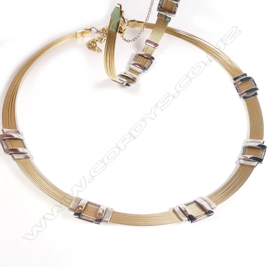 A stylish modern 14ct. yellow and white gold necklace and matching bracelet Image 1++