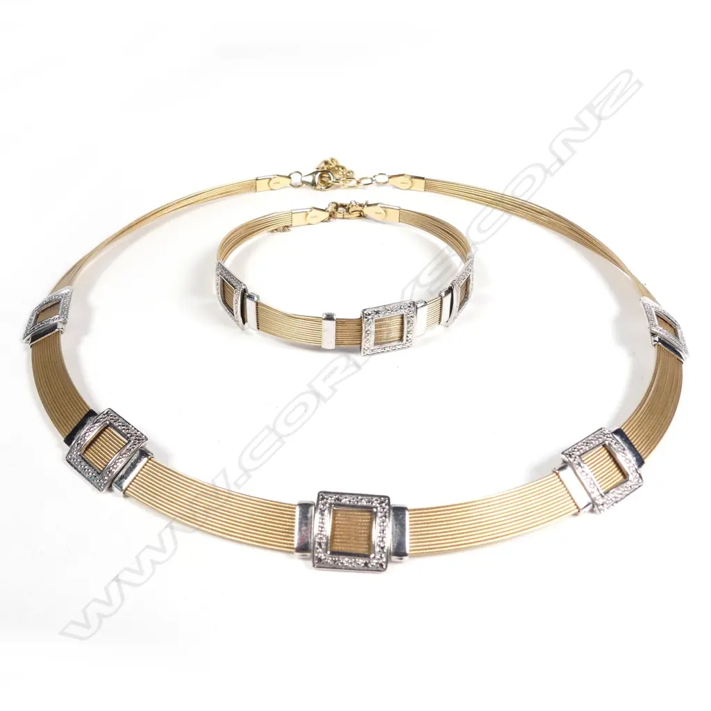 A stylish modern 14ct. yellow and white gold necklace and matching bracelet Image 1++