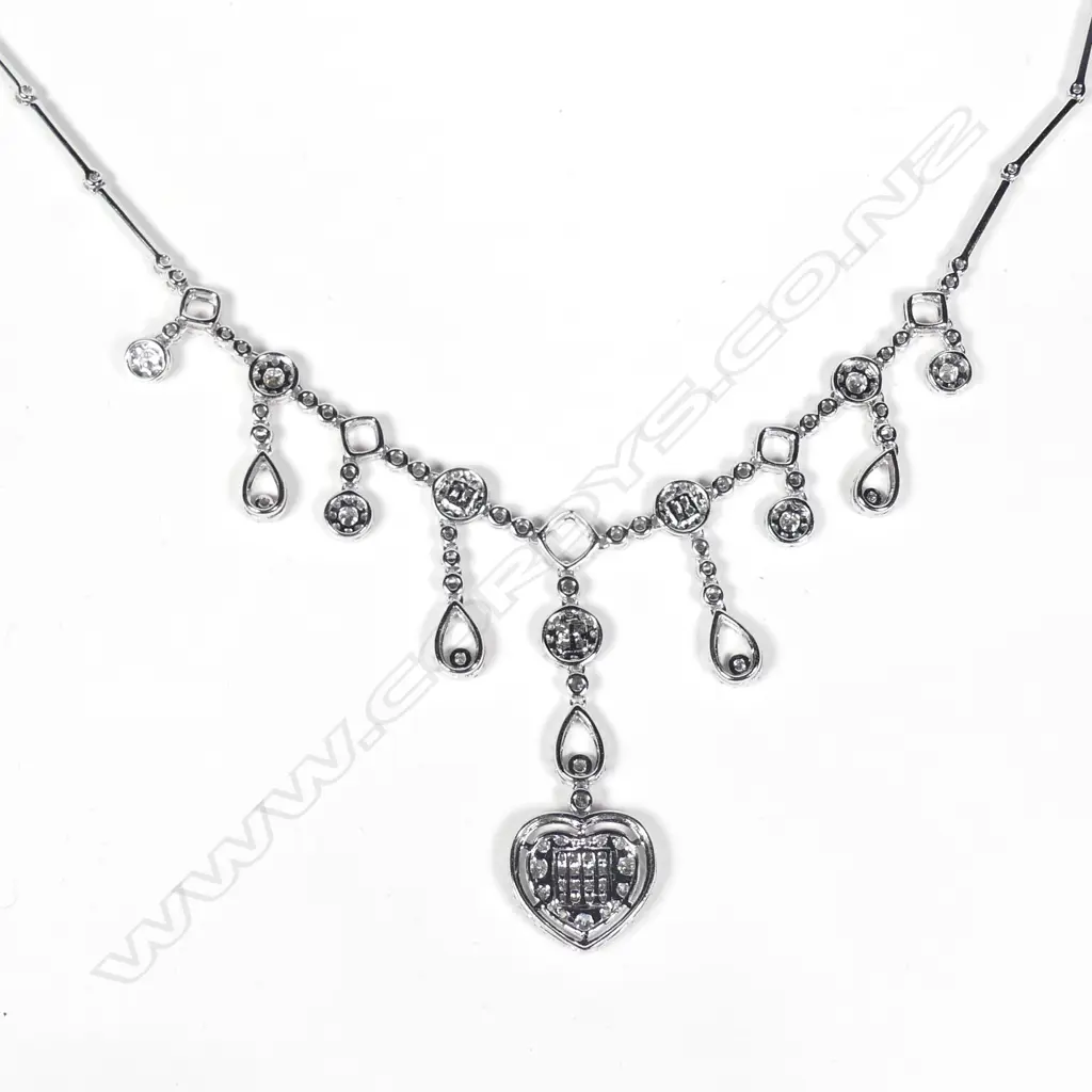 A modern 18ct. white gold and multi-diamond set pendant necklace Image 1++
