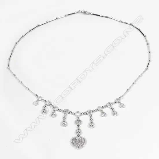 A modern 18ct. white gold and multi-diamond set pendant necklace