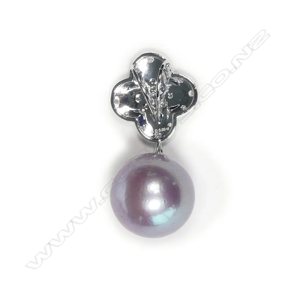 A 14ct white gold diamond and pearl pendant Image 1++