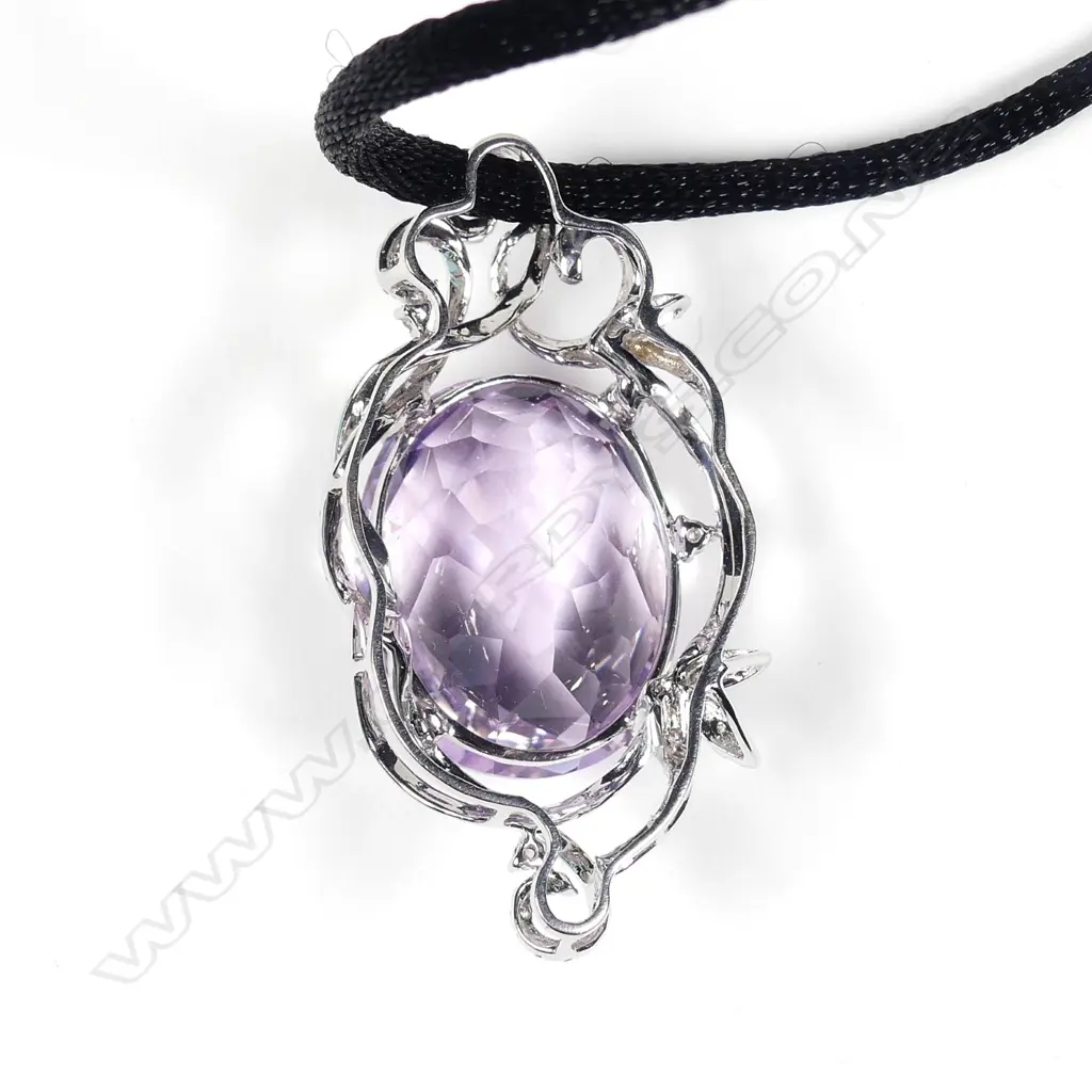 An impressive 18ct white gold large oval facet cut amethyst and diamond pendant Image 1++