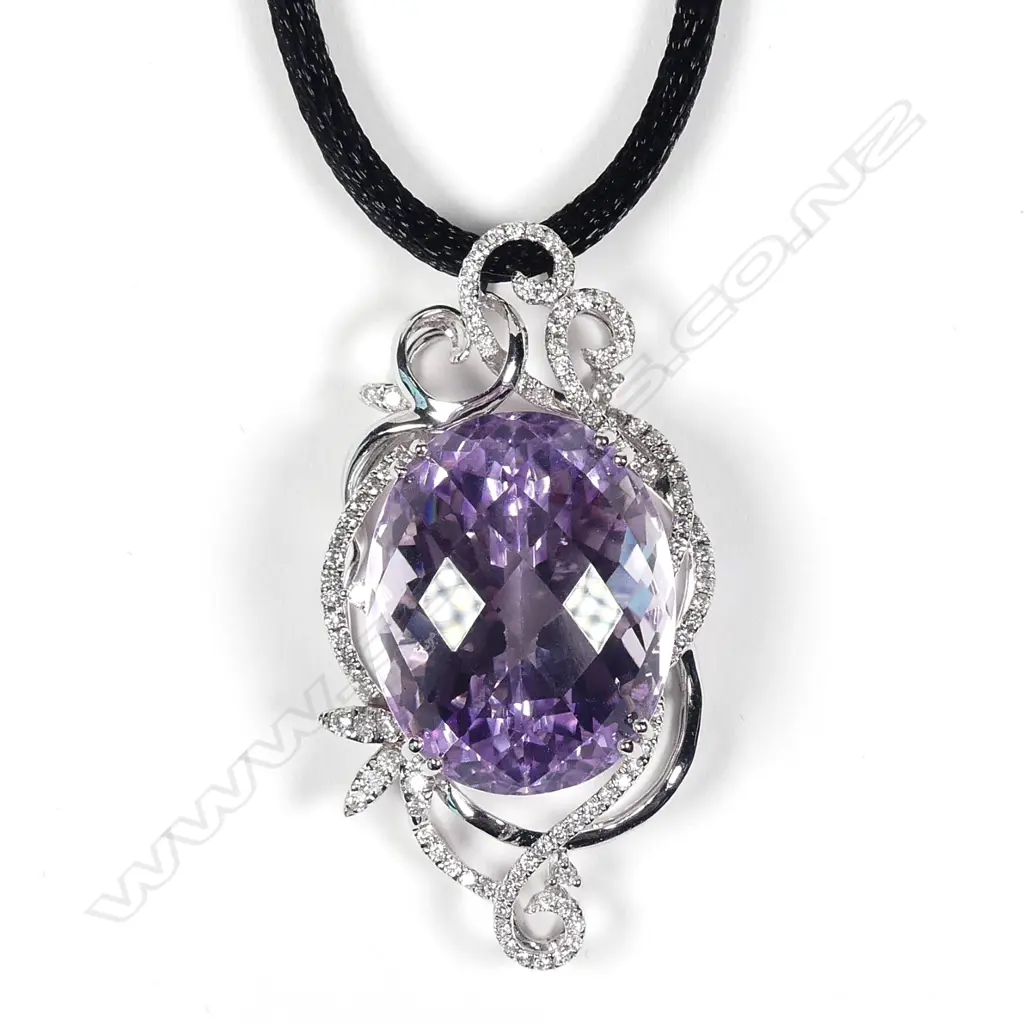 An impressive 18ct white gold large oval facet cut amethyst and diamond pendant Image 1++