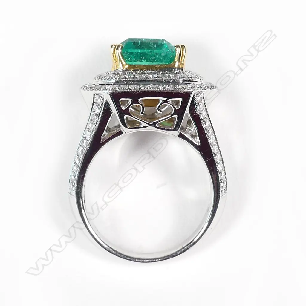 An impressive 18ct white gold emerald and diamond ring Image 1++