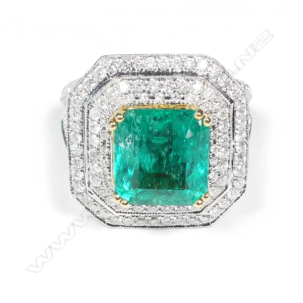 An impressive 18ct white gold emerald and diamond ring Image 1++