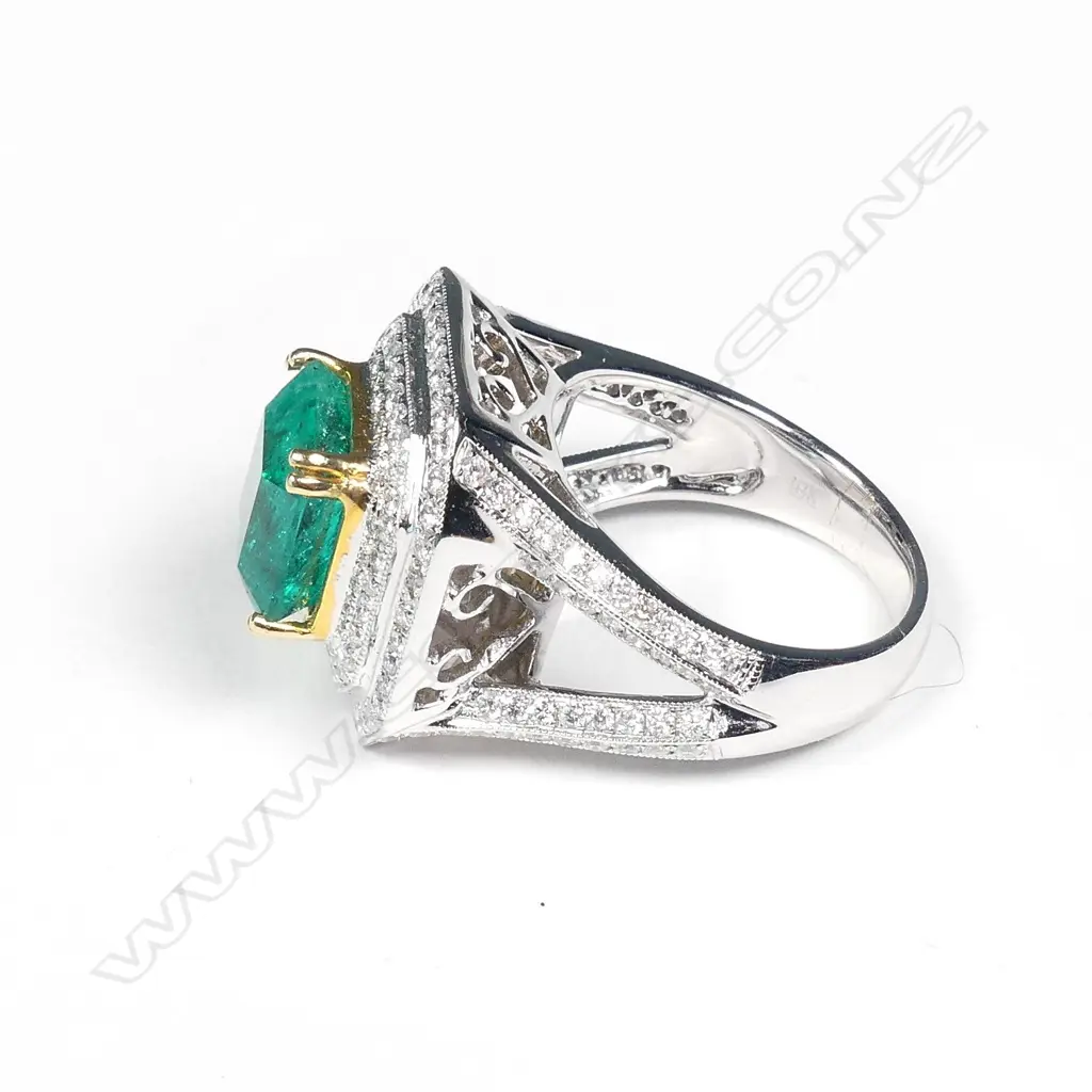 An impressive 18ct white gold emerald and diamond ring Image 1++