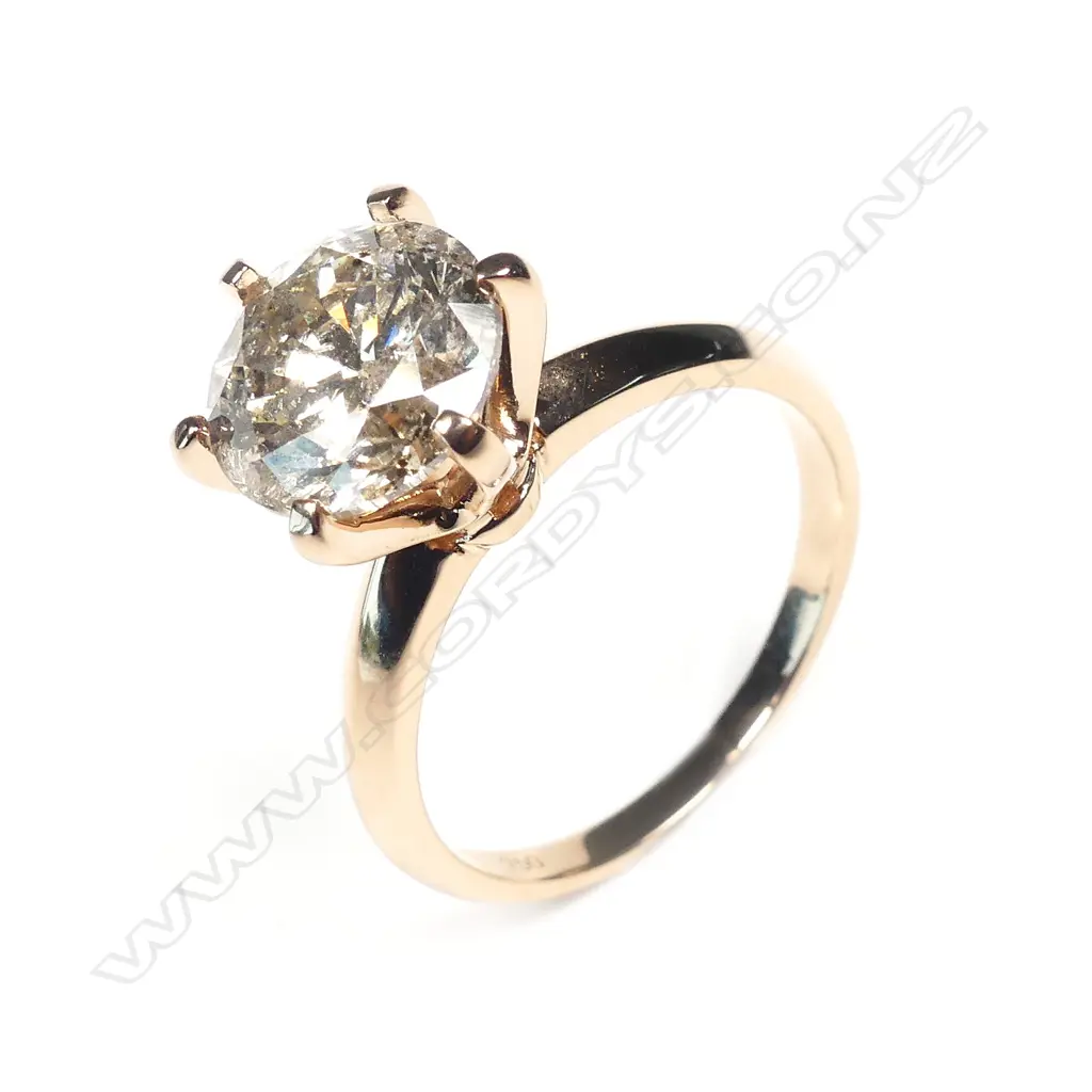 An 18ct rose gold and 3ct diamond solitaire ring Image 1++