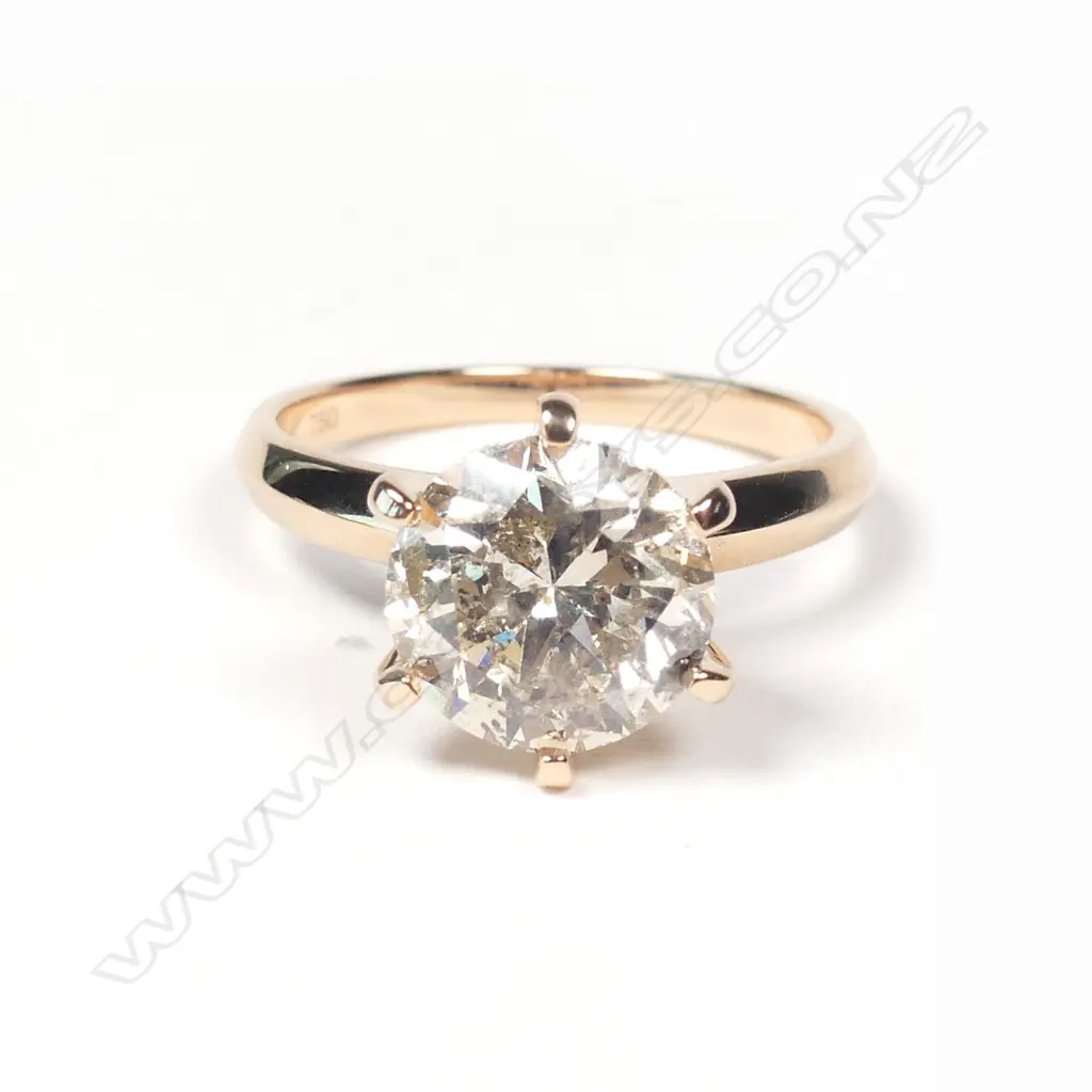 An 18ct rose gold and 3ct diamond solitaire ring Image 1++