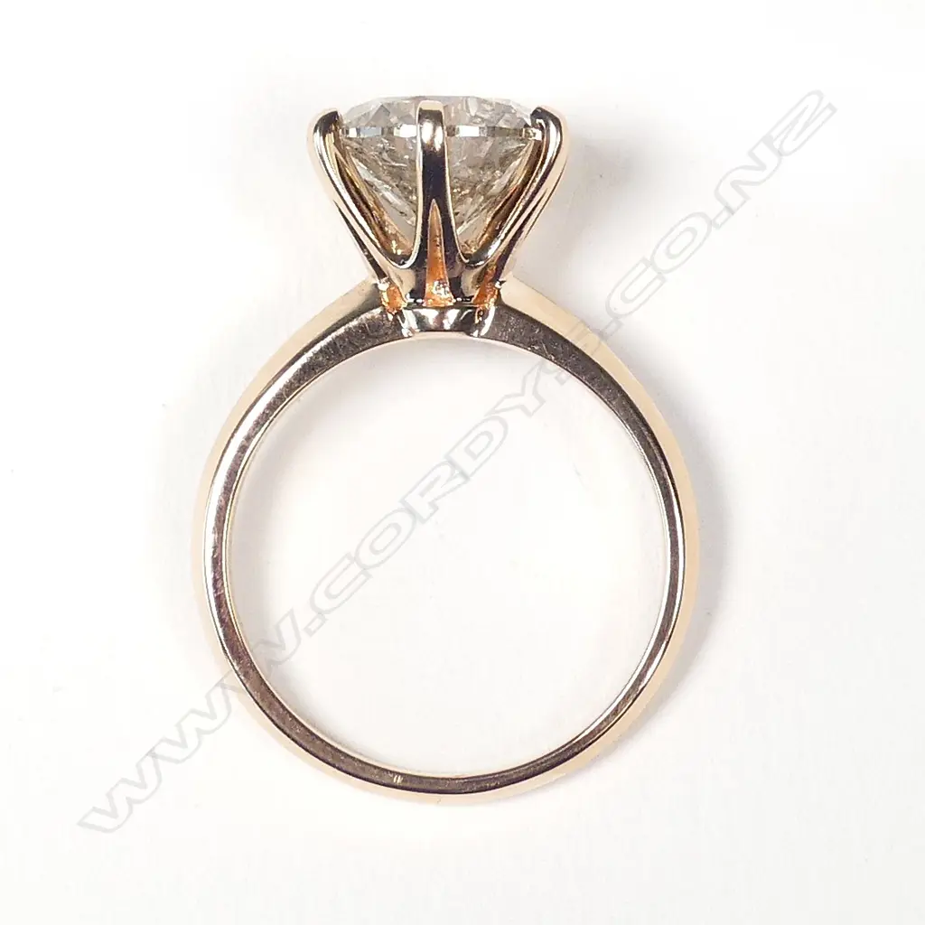 An 18ct rose gold and 3ct diamond solitaire ring Image 1++