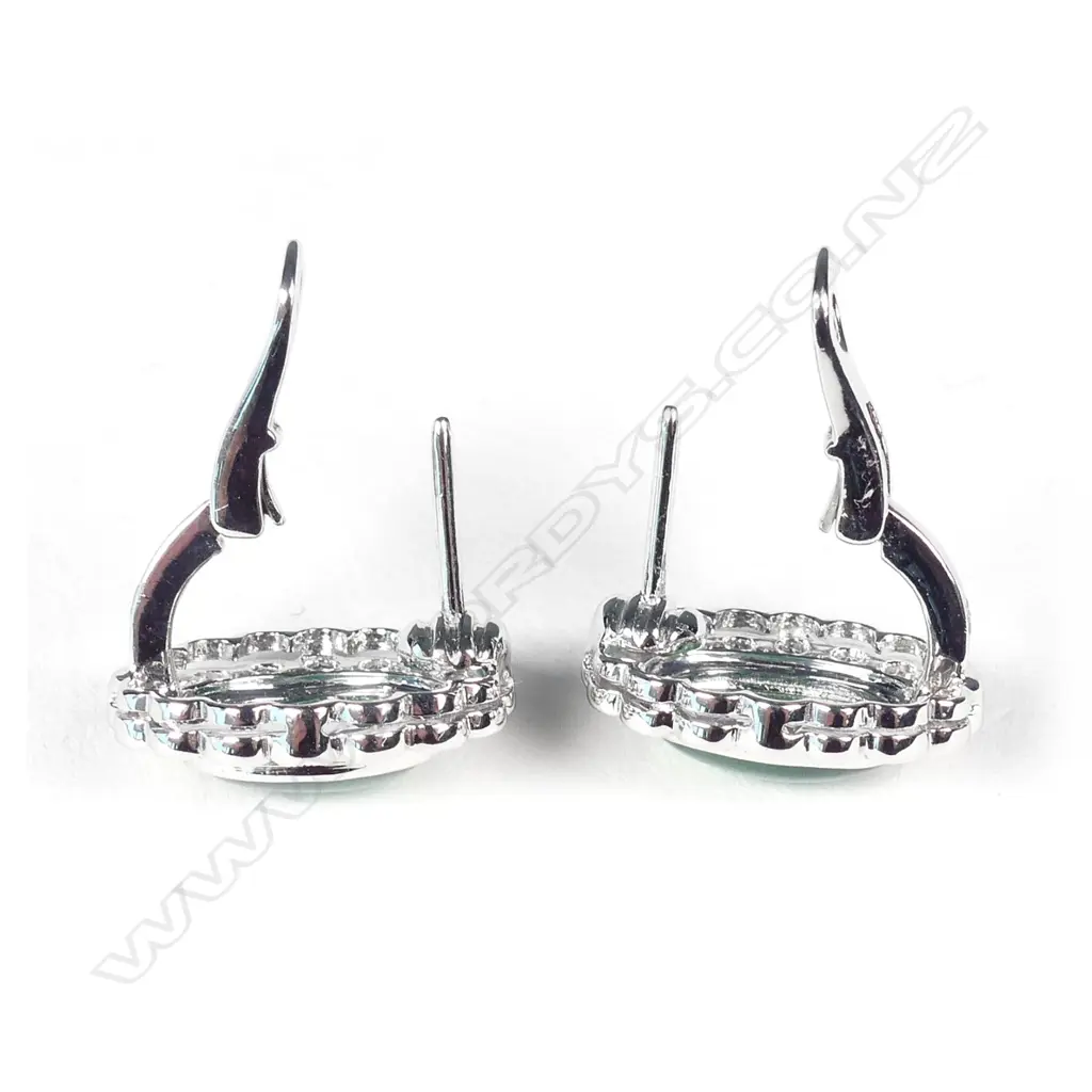 An 18ct white gold jade and diamond ring and earring set Image 1++